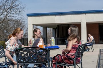 Students outside Deperno laughing - Spring Scenics_008
