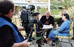 Professors John Johnsen, Thomas Crist, and Carolynne Whitefeather speak with an Albanian television reporter during an interview on their work at Butrint, one of several appearances they made in the Albanian media.