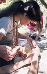 Albania native Elona Pira pieces together a human cranium found at Butrint.