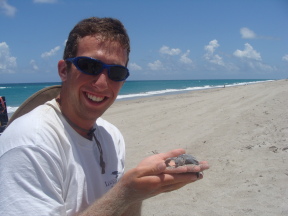 Matt with sea turtle hatchling