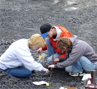 UC students hunting fossils on a field expedition.