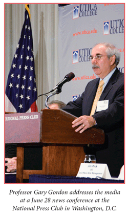 Professor Gary R. Gordon addresses the media at a June 28 news conference at the National Press Club in Washington, D.C.