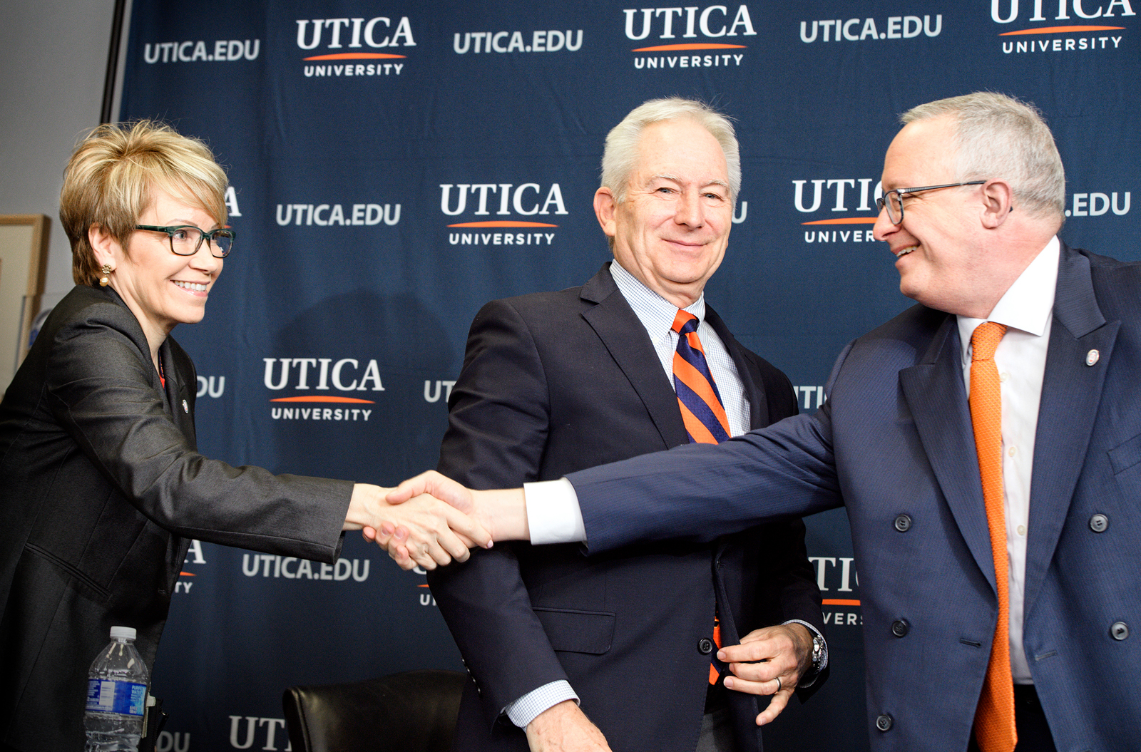 Dr. Pfannestiel (right) shakes President Casamento's hand at the announcement