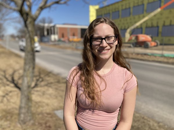 Neuroscience major Taylor Brown '22 stands in front of the under-construction Science Center expansion.