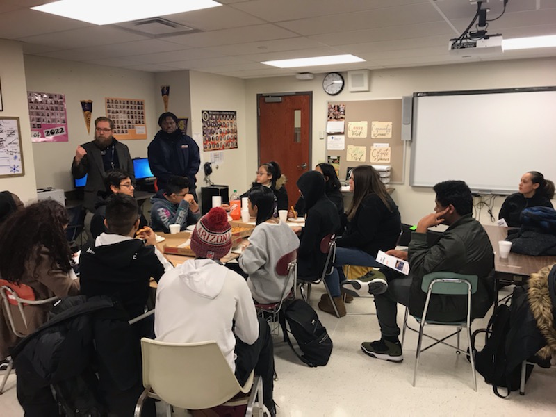 Utica College HEOP & CSTEP staff talk to Young Scholars & friends over pizza