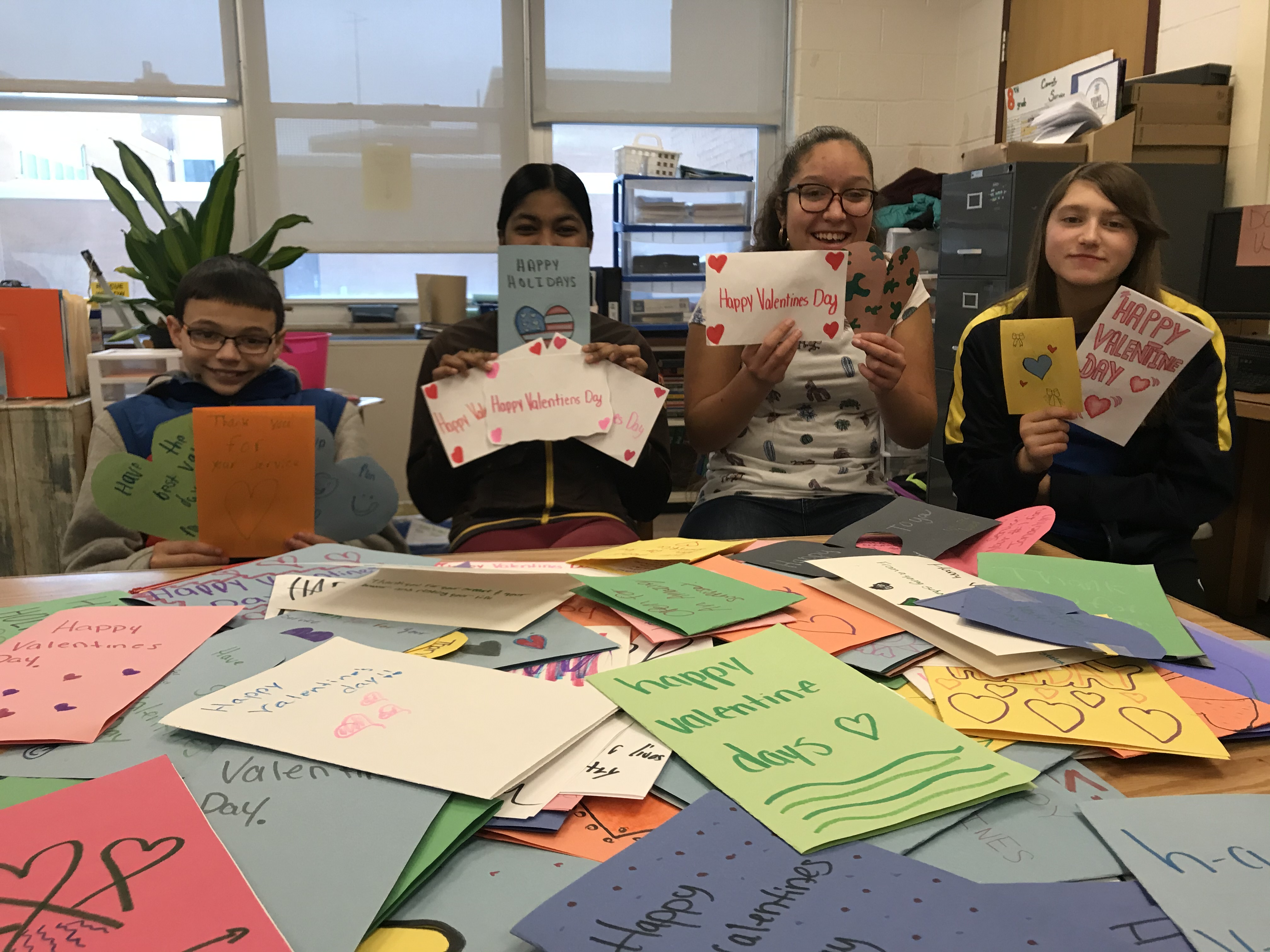 Our JFK students show off handmade Valentines Day cards they made for veterans