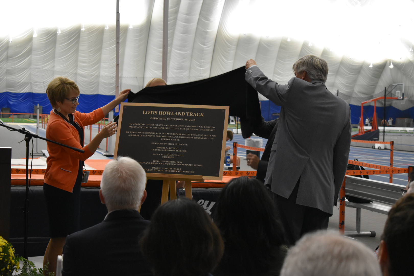 President Laura Casamento reveals a plaque dedicating the track as the  Lotis Howland Track.