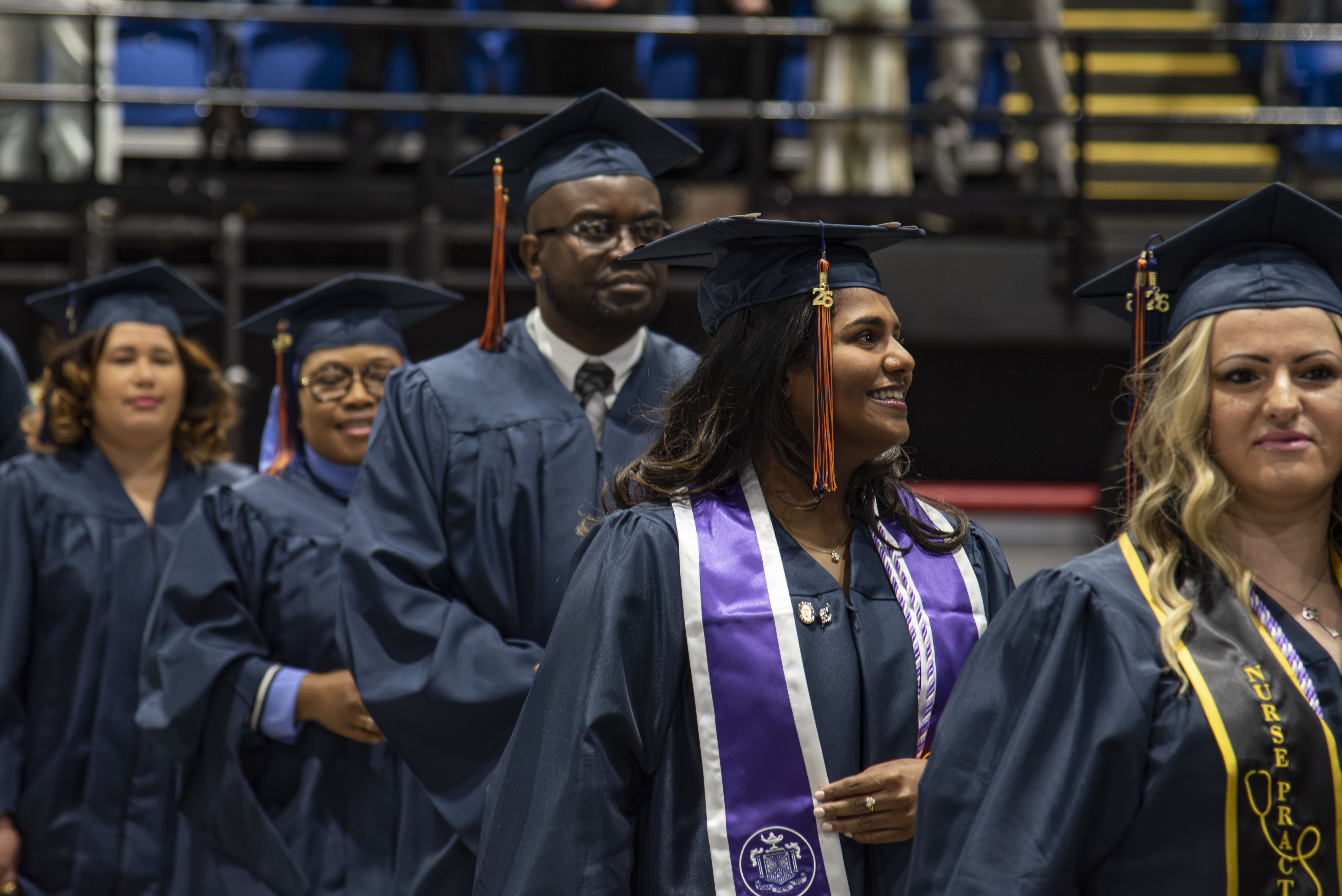 Members of the Graduate Class of 2026 in blue gowns and caps.