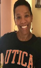 Lisa McCarthy Dennis in Utica College shirt.