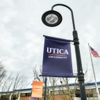 Utica banner on campus