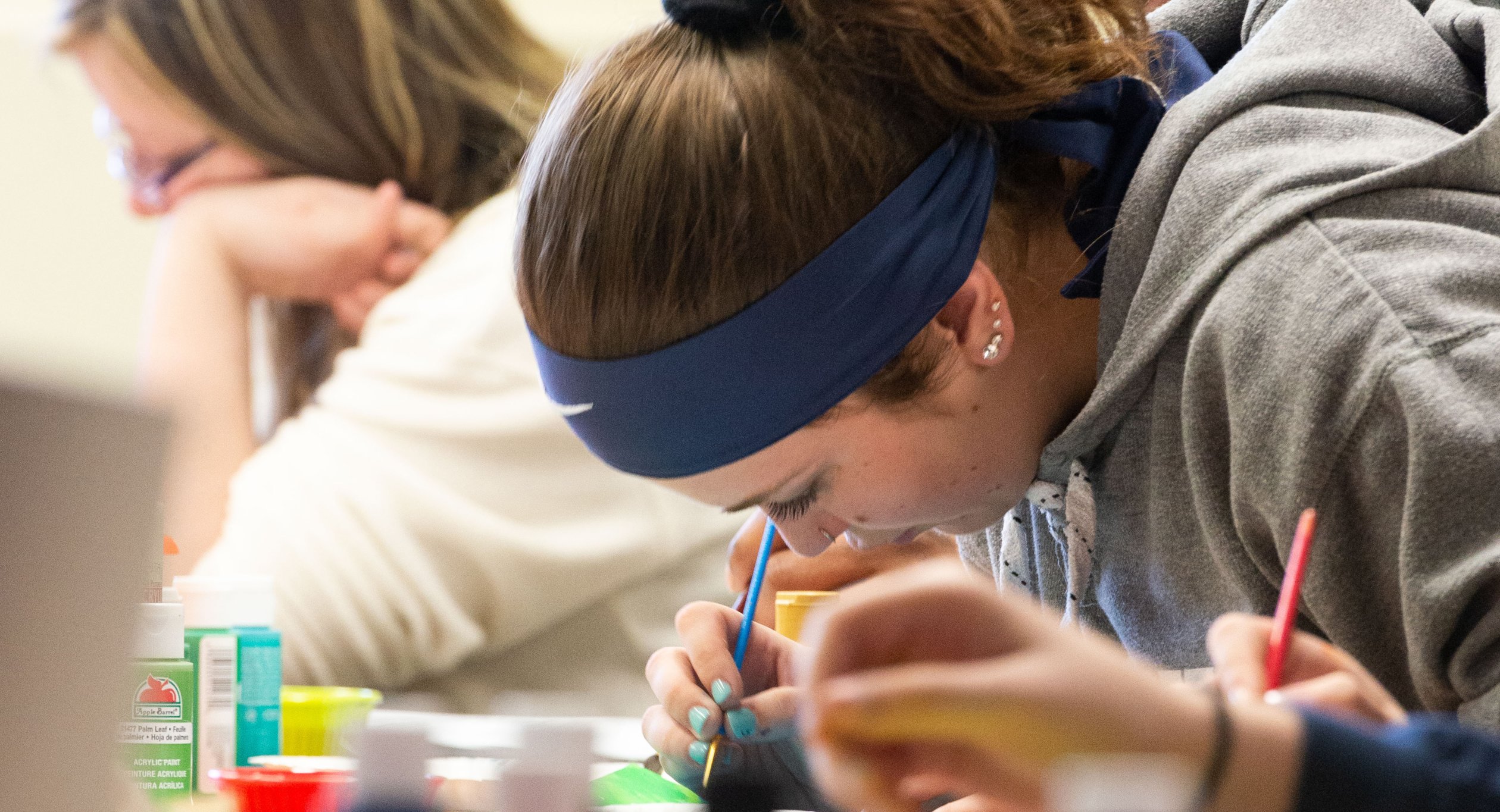 Students studying Therpaeutic Recreation use painting as a therapy process.