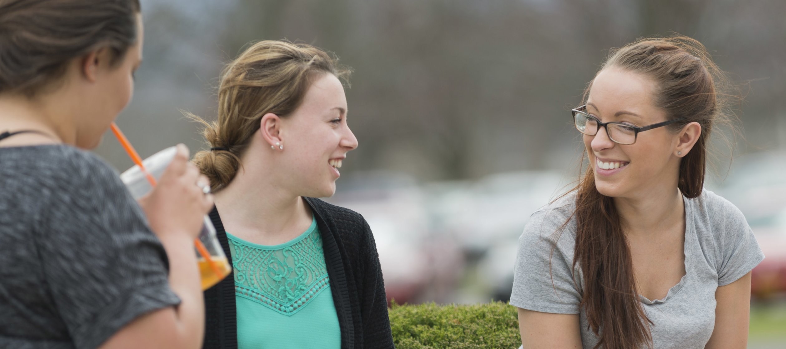 Campus Scenic - Students Talking by bushes - Spring 062