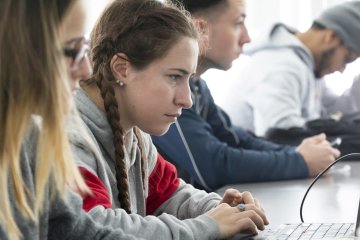 Student at computer in Joseph Giordano Cybersecurity class 0090