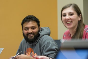 Students smiling in Nesbitt Business class 611_0155