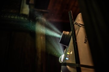Light shining through a film projector
