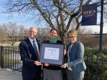 Professor Sara Scanga with Provost Todd Pfannestiel and President Laura Casamento receiving the Harold T Clark Award.