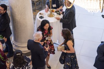 Guests chat at the Community Dinner.
