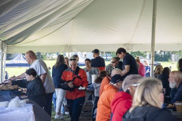 People enjoy the Construction Management BBQ at 2026 Homecoming.