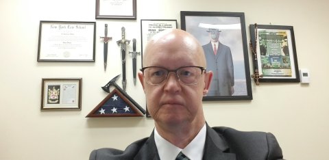 Headshot of Larry Dillon sitting in his office.