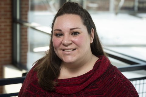 Bethany VanBenschoten stands in front of a window.