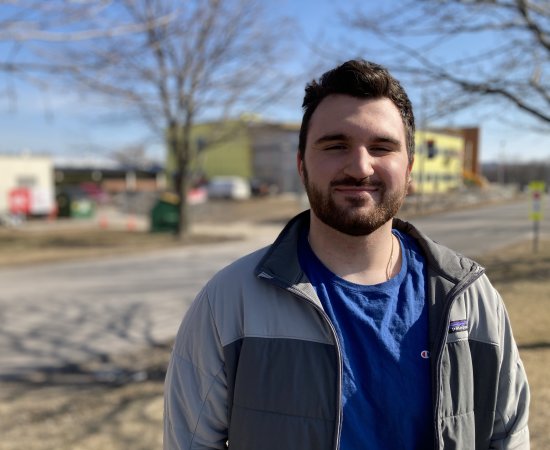 Connor Yingling '22 stands outside the under construction science center expansion.