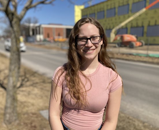 Neuroscience major Taylor Brown '22 stands in front of the under-construction Science Center expansion.