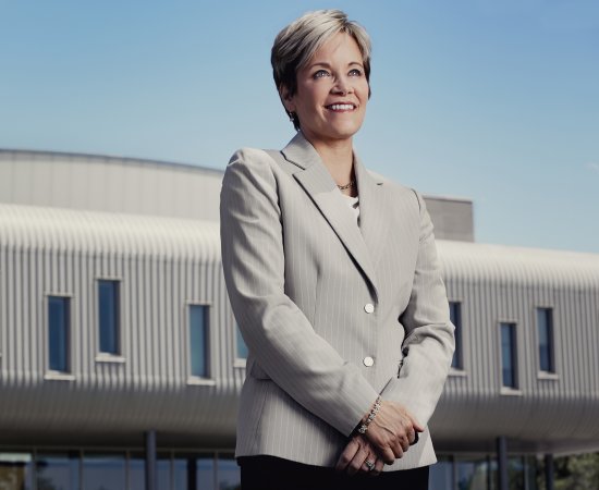 President Laura Casamento stands in front of the ECJS building.
