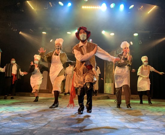 The cast of the 2021 UC theatrical production, Something Rotten, in the middle of a dance number.