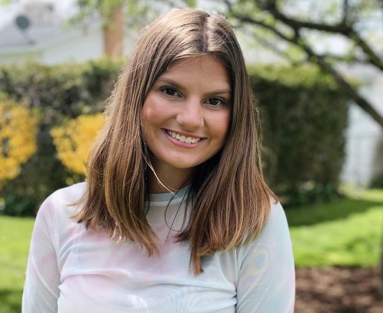 Cassondra Wardle '22 stands outside smiling.