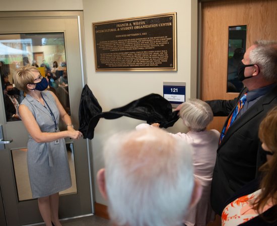 President Laua Casamento and Provost Todd Pfannestiel reveal a plaque during a dedication ceremony of the Wilcox Center on September 08, 2021.