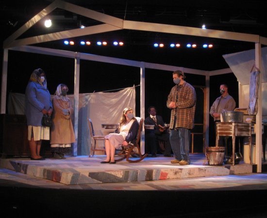 Performers on stage in a scene from Trifles, the Fall 2021 production at Utica College.