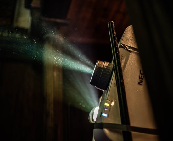 Light shining through a film projector