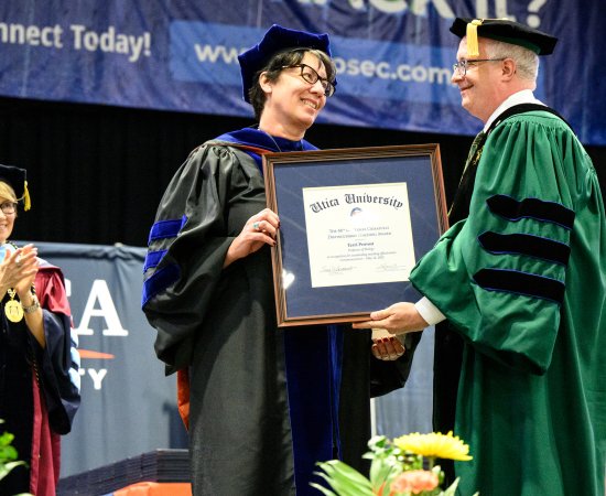 Terri Provost receives the Crisafulli Distinguished Teaching Award during the 2022 Undergraduate Commencement Ceremony.