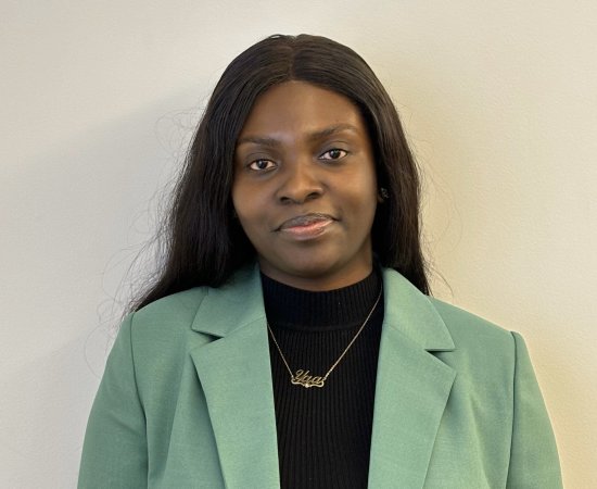 Maame Yaa Boakye, Class of 2020, in black shirt and green jacket.