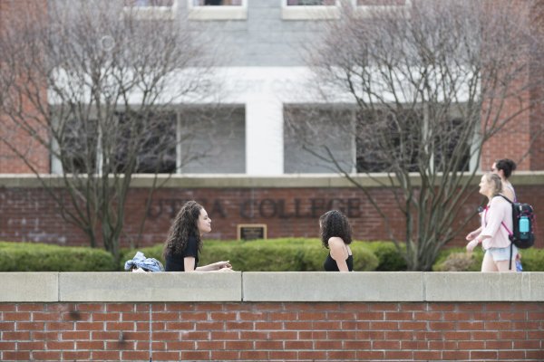 Campus Scenic - Spring - Women Sitting in front of Boehlert Hall