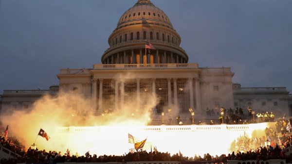Smoke rises amid mobs assaulting the captiol on January 6, 2021.