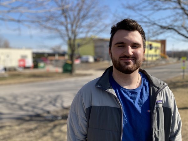 Connor Yingling '22 stands outside the under construction science center expansion.