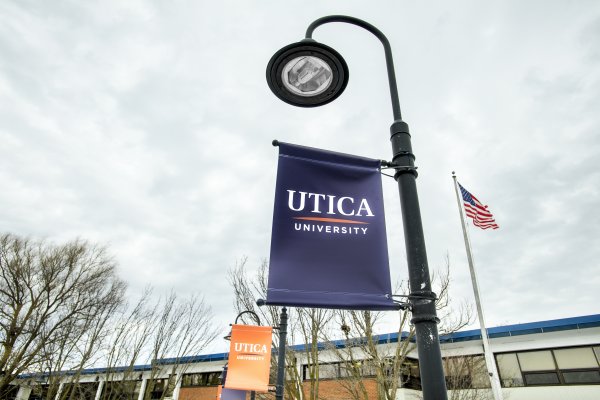 Utica banner on campus