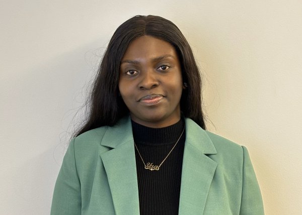 Maame Yaa Boakye, Class of 2020, in black shirt and green jacket.