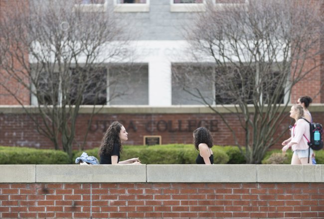 Campus Scenic - Spring - Women Sitting in front of Boehlert Hall