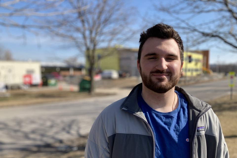 Connor Yingling '22 stands outside the under construction science center expansion.